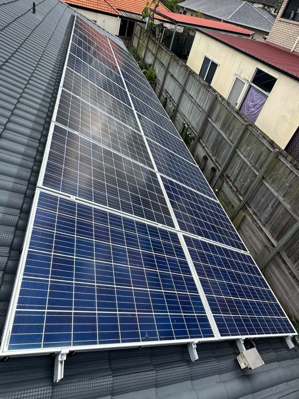 The same solar array after pigeon-proofing mesh has been installed along the edges of the panels