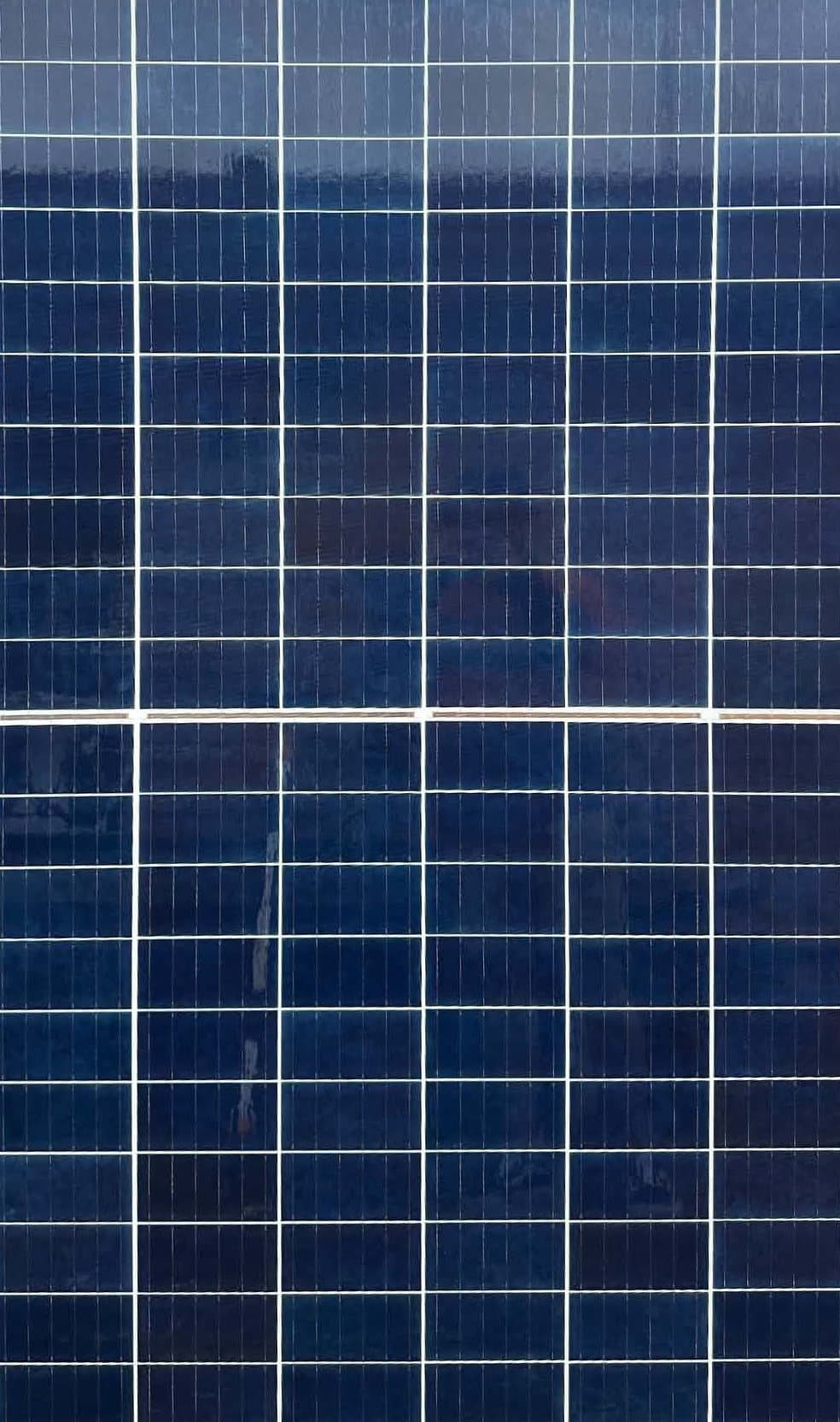 The same solar panel after cleaning, with a clean, clear glass surface